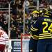 The Michigan team celebrates scoring in the second period of the game against Miami on Saturday, March 23. Daniel Brenner I AnnArbor.com
